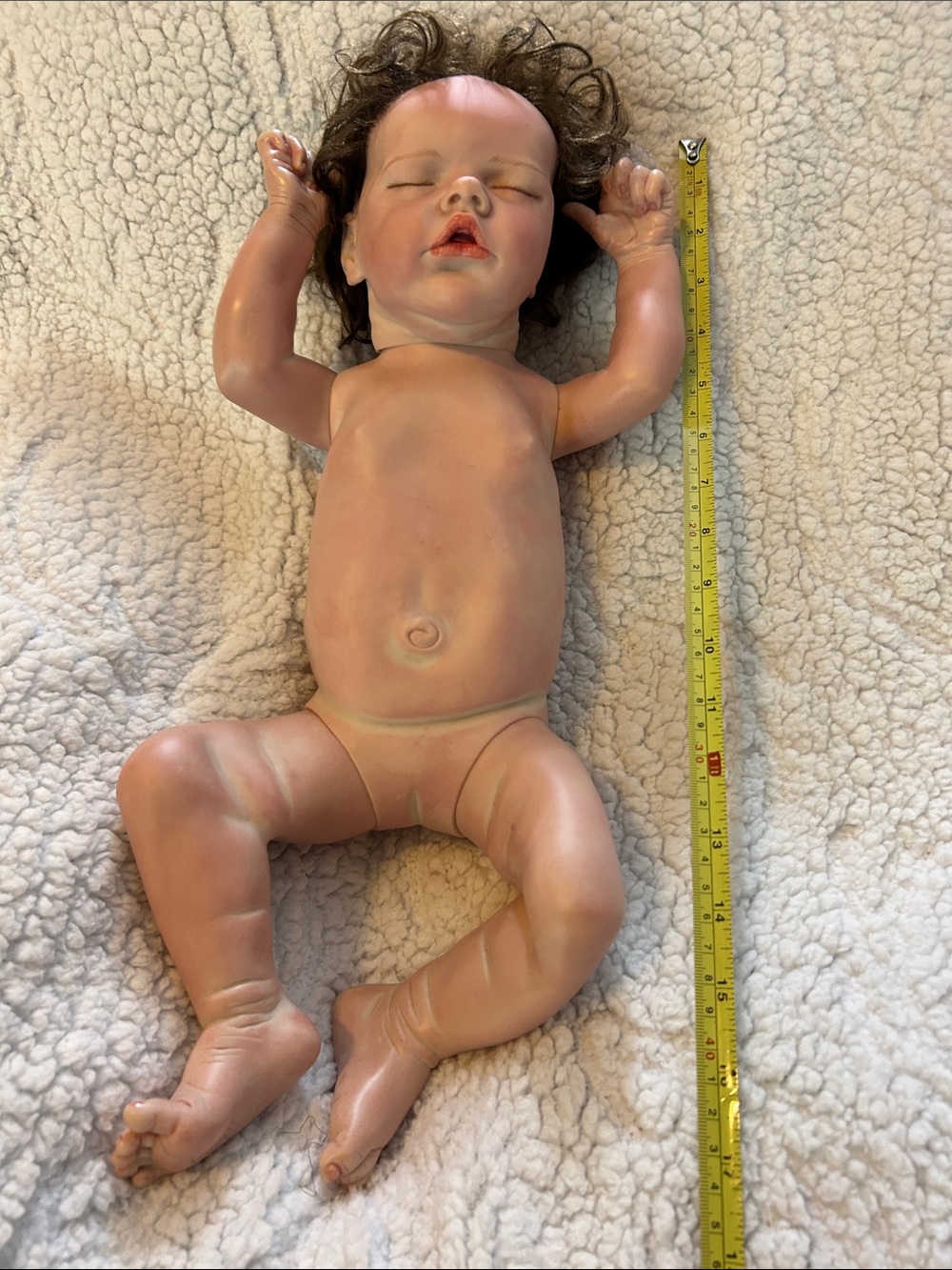 Lifelike Brown-Haired Baby Doll in Flesh-Tone Vinyl
